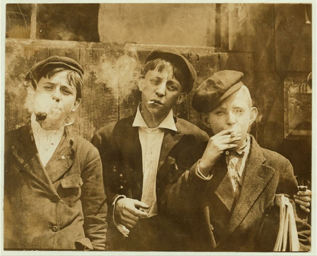 11:00 A. M . Monday, May 9th, 1910. Newsies at Skeeter's Branch, Jefferson near Franklin. They were all smoking. Location: St. Louis, Missouri.